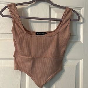 Pink Rib Dip Hem Sleeveless Crop Top PRETTYLITTLETHING